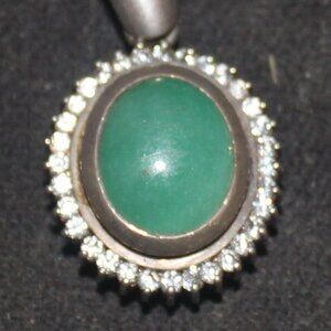 Oval Sterling Silver Jade Diamondaura Stones Surrounding The Pendant